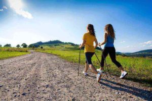 two girls nordic walking for exercise