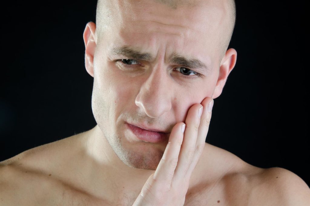man suffering from toothache tooth pain