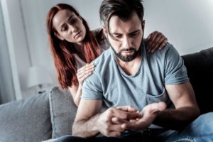 wife supporting husband with drug addiction