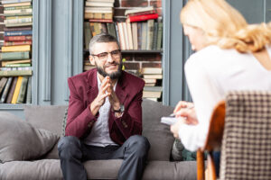 a person talks to a therapist during an acceptance and commitment therapy program