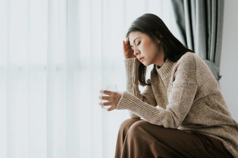 Person sitting next to window and learning what a dry drunk is